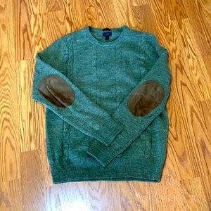 Green J. Crew sweater with suede elbow patches.